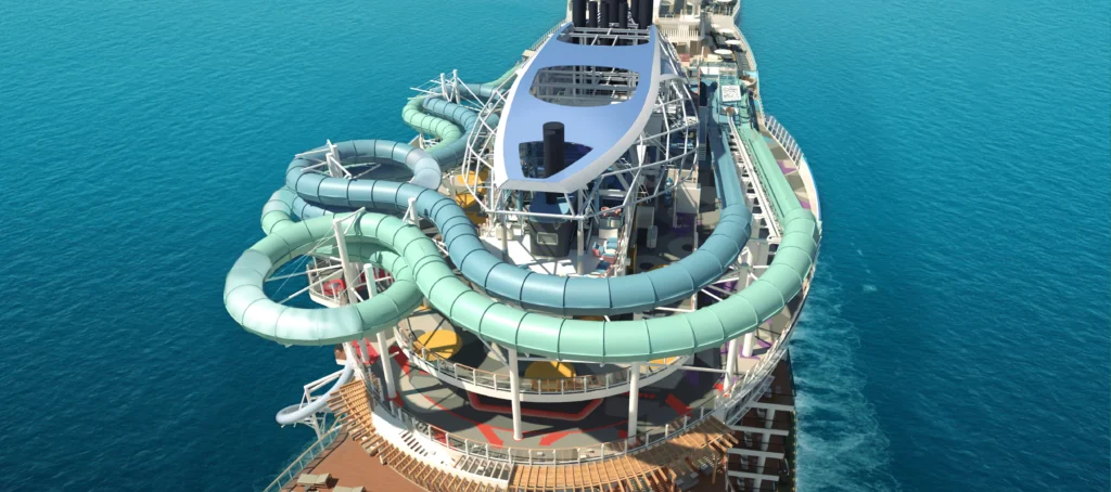 Guest riding the Norwegian Aqua Slidecoaster above the ocean