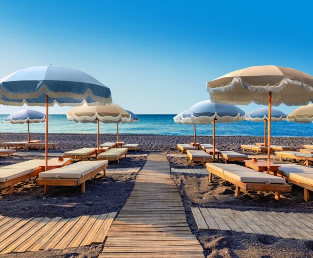 Plush towels, shaded loungers, and breathtaking views from a secluded black‑sand beach… this is relaxation redefined at Royal Beach Club Santorini 🌅💙

Make this your next getaway — message me at carlywhite@soaringholidays.com today to start planning!